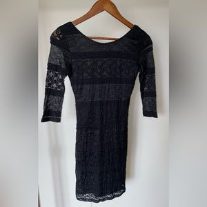 Three quarter length sleeved black lace dress
